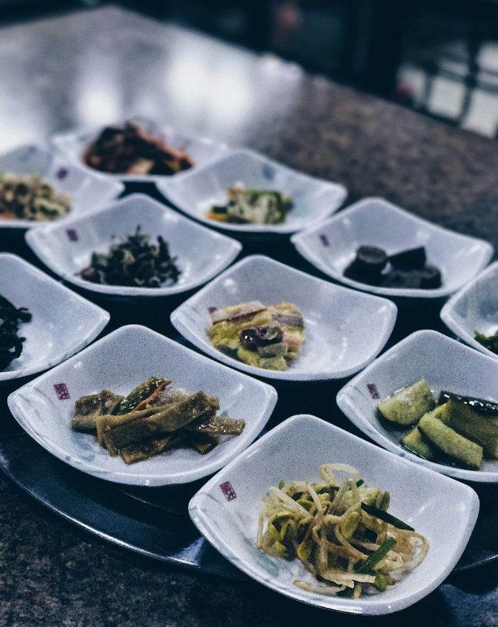 Korean side dishes plated on the table